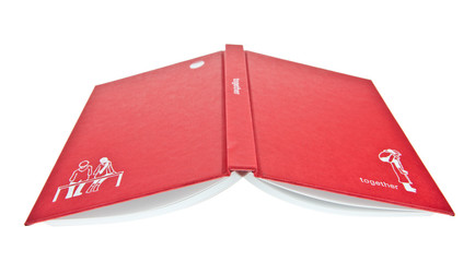 Red cover book open upside down