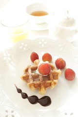 Strawberry on waffle with English tea