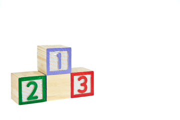 number 123 from letter wooden blocks as a podium