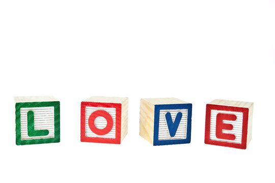 Love by block toy isolated on white background