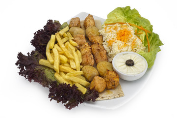 BBQ plate of shish tawook with tomato potato hommos dip