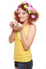 Naklejka premium smiling ginger woman in yellow cloth with flowers in hair