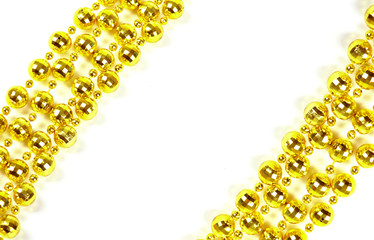 Background made of a brilliant celebratory beads of golden color