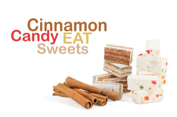 Sweets and cinnamon sticks isolated on white background
