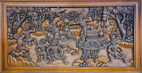 The ramayana epic wood carved on temple wall, Thailand