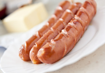 frankfurter sausage hot dog food at plate