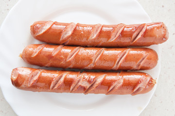 frankfurter sausage hot dog food at plate