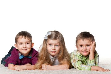 Three children on the carpet