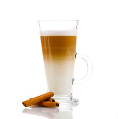 Fragrant сoffee latte in glass cup and cinnamon isolated