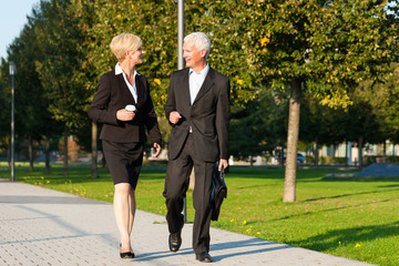 Business people talking outdoors