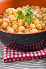 Chickpea soup in terracotta bowl. Zuppa di ceci.
