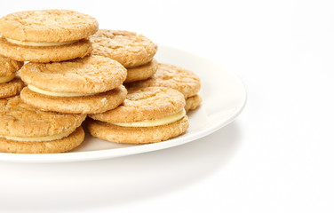 Fototapeta na wymiar Plate of cream biscuits