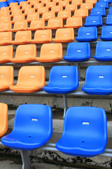 Naklejka premium plastic, yellow and blue, new chairs in stadium.