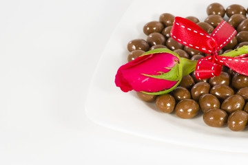 Chocolate heart and rose in the Valentine's Day