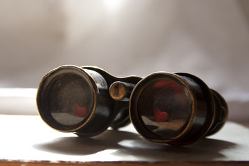 Binoculars with the heart reflected in the lens