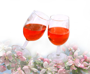 wine glasses  among spring flowers