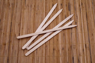 Wooden kebab sticks on bamboo background