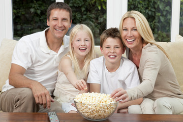 Happy Family Eating Popcorn Watching Television