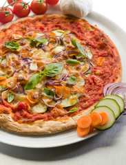 vegetarian pizza with zucchinis carrots,onions and mozzarella