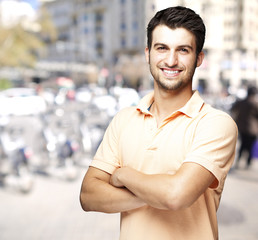 Fototapeta premium portrait of a comely young man smiling at a crowded street