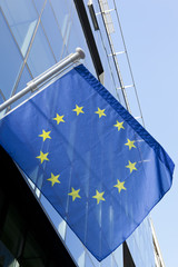 European union flag on a glass modern building