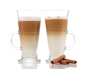 Fragrant сoffee latte in glass cups and cinnamon isolated