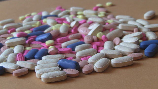 Various kinds of medicine tablets rotating