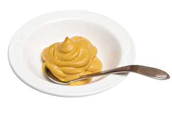 mustard in a ramekin with a spoon isolated against white