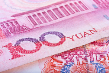 Cropped close-up of Chinese RMB banknotes with limited DOF