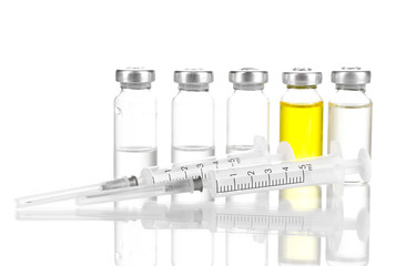 Syringes and medical ampoules isolated on white