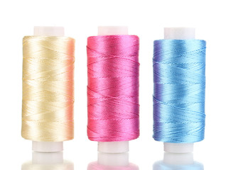Three bobbin thread isolated on white