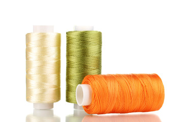 Three bobbin thread isolated on white