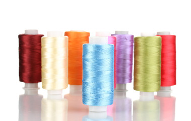 Many spools of thread isolated on white