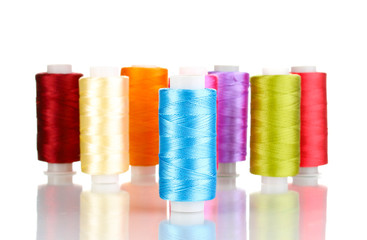 Many spools of thread isolated on white