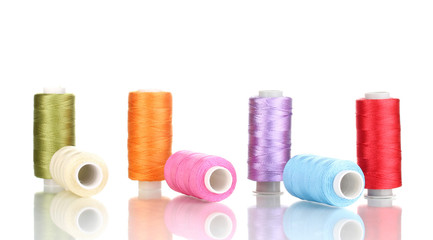 Many spools of thread isolated on white