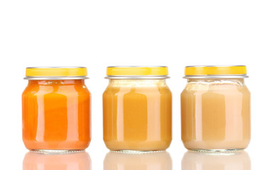 Jars of baby puree isolated on white