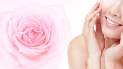 Obraz premium young woman smile mouth with pink rose flower