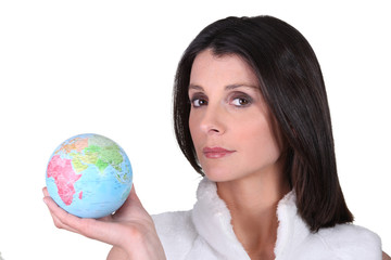 Woman with globe in hand