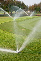 Watering in golf course - 39799062