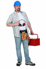 Construction worker with ear defenders