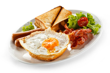 English breakfast - toast, egg, bacon and vegetables
