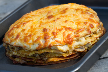 Pancake pie with mushrooms and cheese