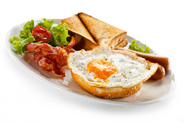 English breakfast - toast, egg, bacon and vegetables