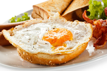 English breakfast - toast, egg, bacon and vegetables