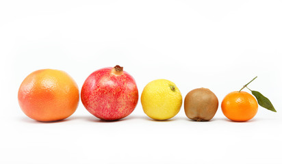 pomegranates and citrus fruits isolated on a white background.