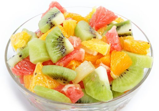 Fresh fruits salad on white background