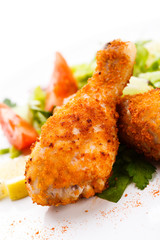 Roasted chicken drumsticks and vegetables