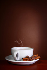 Cup og hot Coffee on brown background