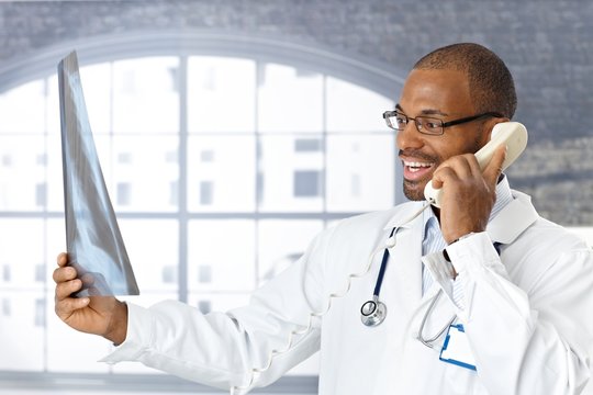 Doctor telling good news on phone