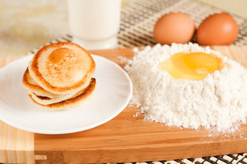 Home pancakes with sour cream, flour and eggs